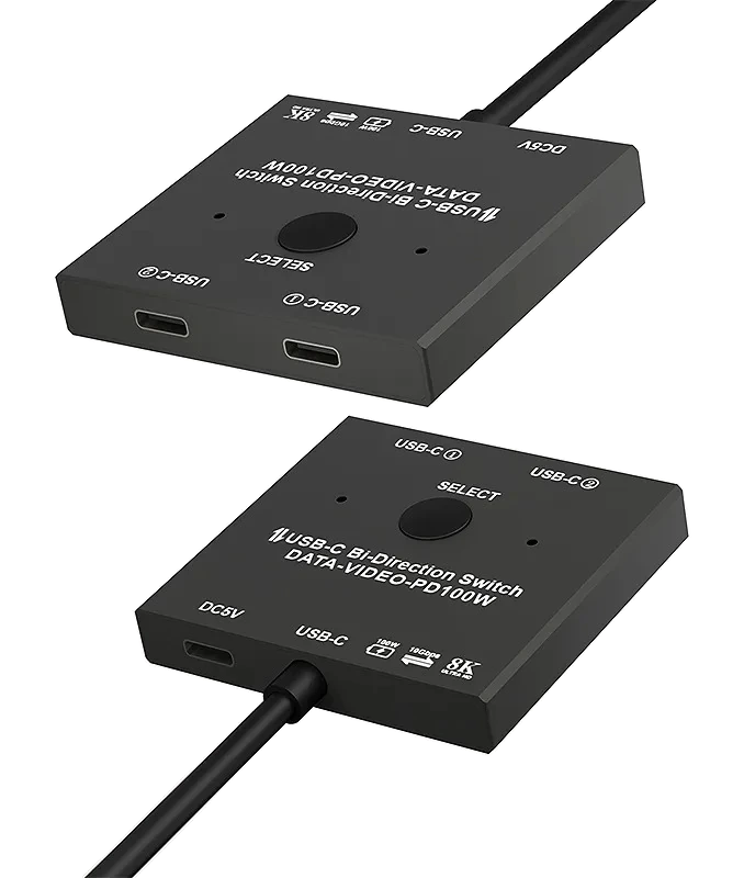 Dois adaptadores USB-C pretos para switch bidirecional de vídeo e dados, sobre fundo branco.
